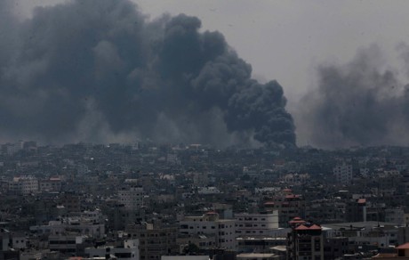 Smoke rises after an Israeli missile hit Shajaiyeh neighborhood in Gaza City